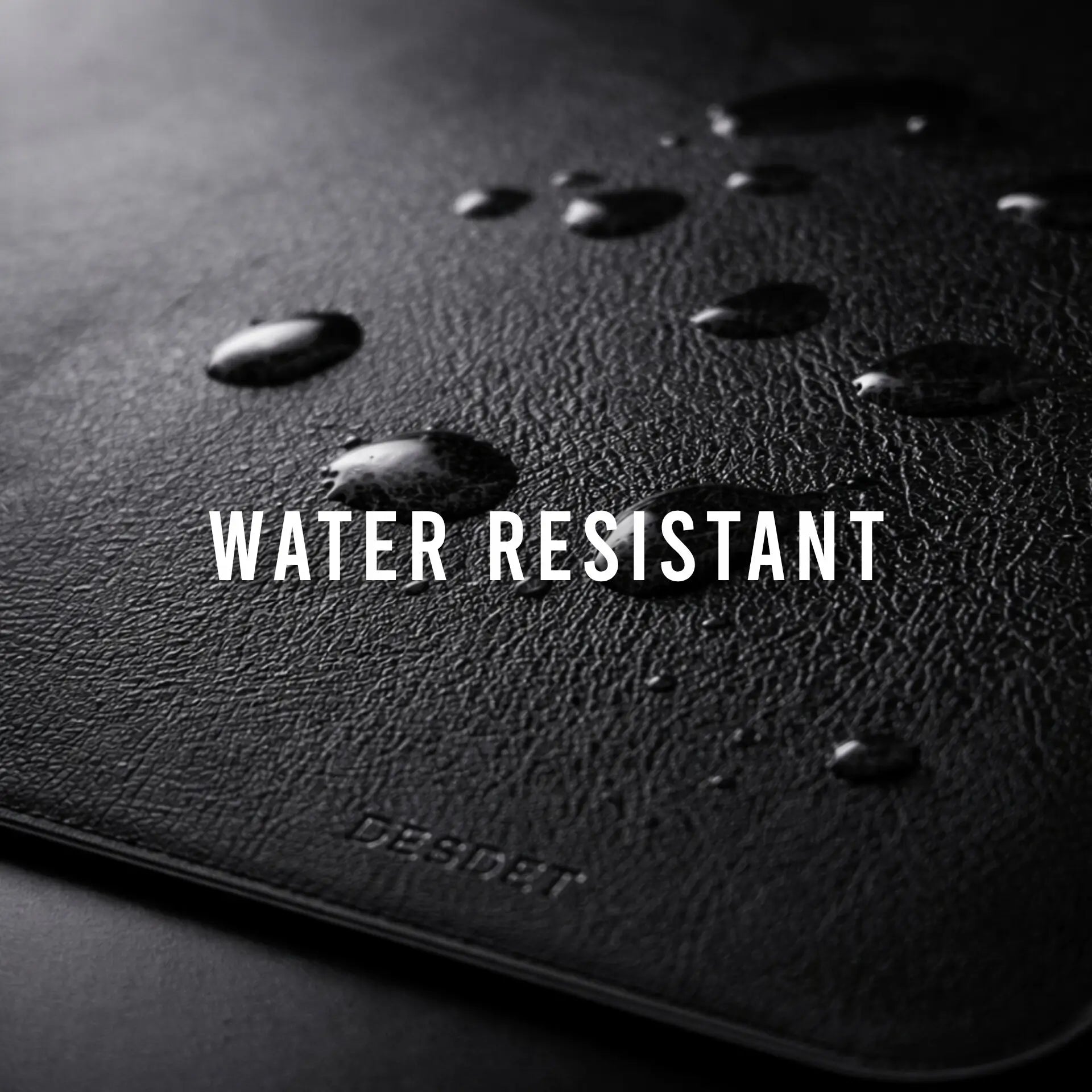 Black surface with water droplets and 'WATER RESISTANT' text, brand 'DESSINI' visible.