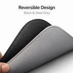 Close-up of Desdet reversible desk mat stitching showing the midnight black and steel grey texture options
